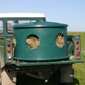  A Hay Hutch loaded onto the back of a Land Rover